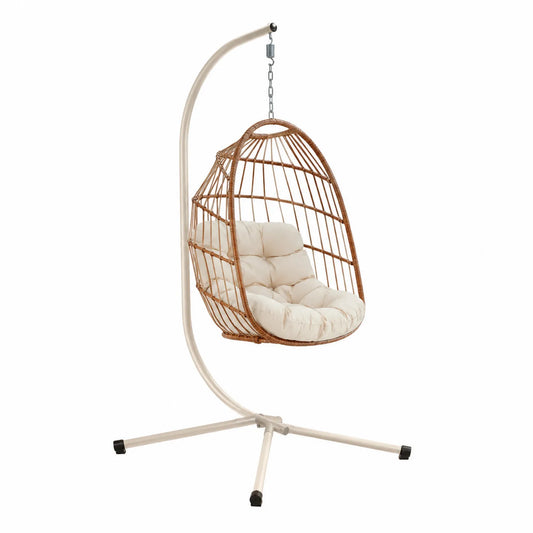 Silla colgante de ratán con cojín crema y soporte de acero